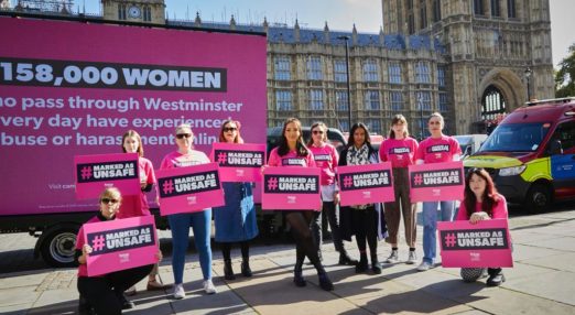 Campaigners outside the Houses of Parliament carrying placards that say "#Markedasunsafe"